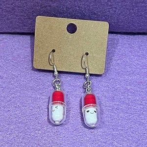 Red pill earrings