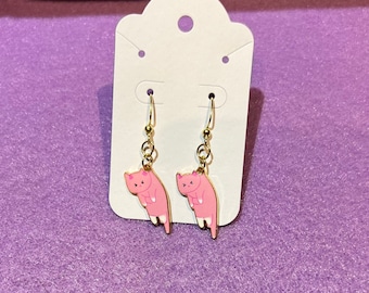 Brincos de gato rosa