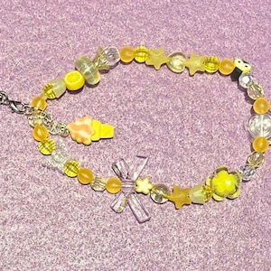Yellow beaded phone strap with ice cream charm