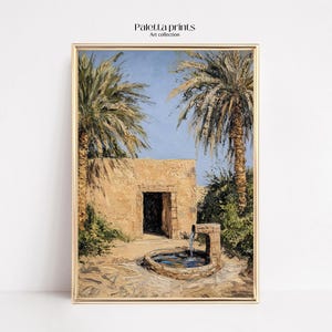 May include: A painting of a stone building with a doorway and a small fountain in front. The building is surrounded by palm trees and other greenery. The painting is framed in a gold frame.