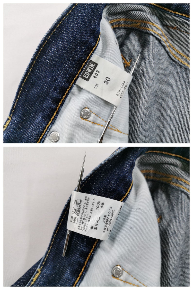May include: Close-up of the inside of blue denim jeans. The jeans have a visible tag with the brand "EDWIN" and size "30". The tag also includes washing instructions and other details. The jeans have a classic five-pocket design.