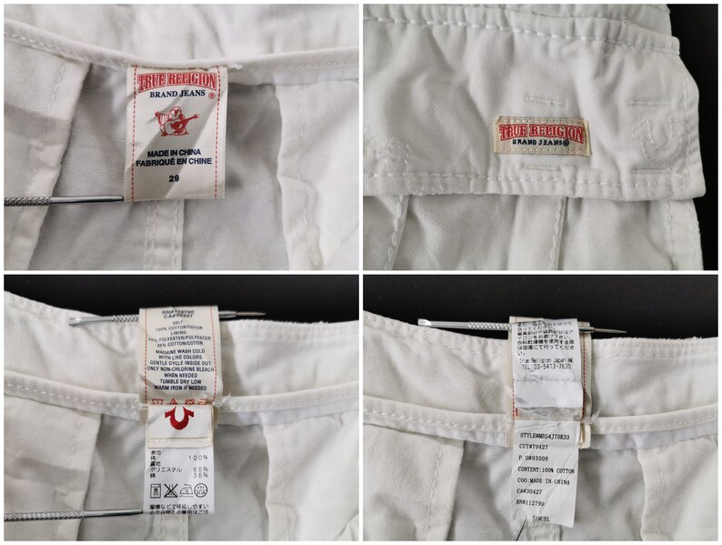May include: Detail of the waistband and labels of white True Religion jeans. The labels show the brand logo, size 29, and manufacturing details. The fabric appears to be a cotton and polyester blend.