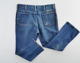 Vintage noodlijdende Rustler merk made in USA jeansbroek maat 37/38 x 28,5