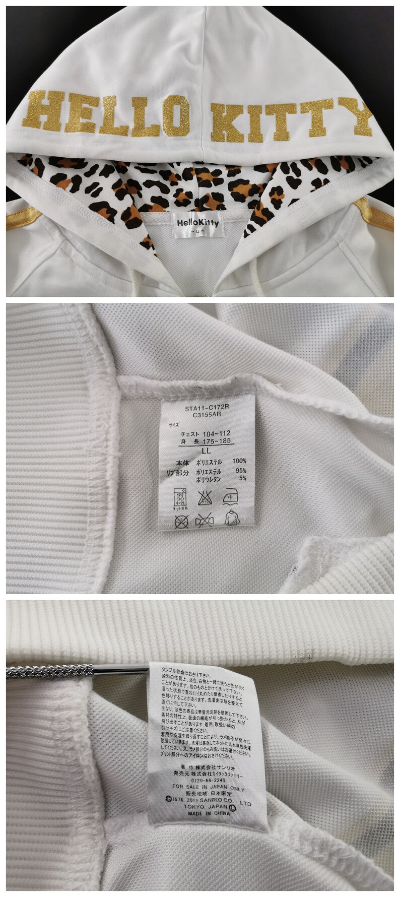 May include: White zip-up hoodie with gold glitter "HELLO KITTY" lettering on the hood. The hood lining features a leopard print. The hoodie has gold stripes on the sleeves and a "Hello Kitty" label.