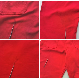 May include: Close-up shots of red work pants, showcasing details like pockets and fabric texture. The pants have a classic design with visible stitching and a durable material. The images highlight the color and construction of the garment.