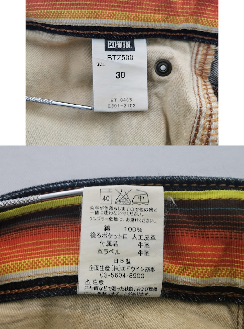Pu&ograve; includere: Primo piano di un paio di jeans in denim con etichette. Le etichette mostrano il marchio "EDWIN", il modello "BTZ500" e la taglia "30". Ulteriori etichette forniscono istruzioni per la cura e la composizione del materiale, tra cui 100% cotone.