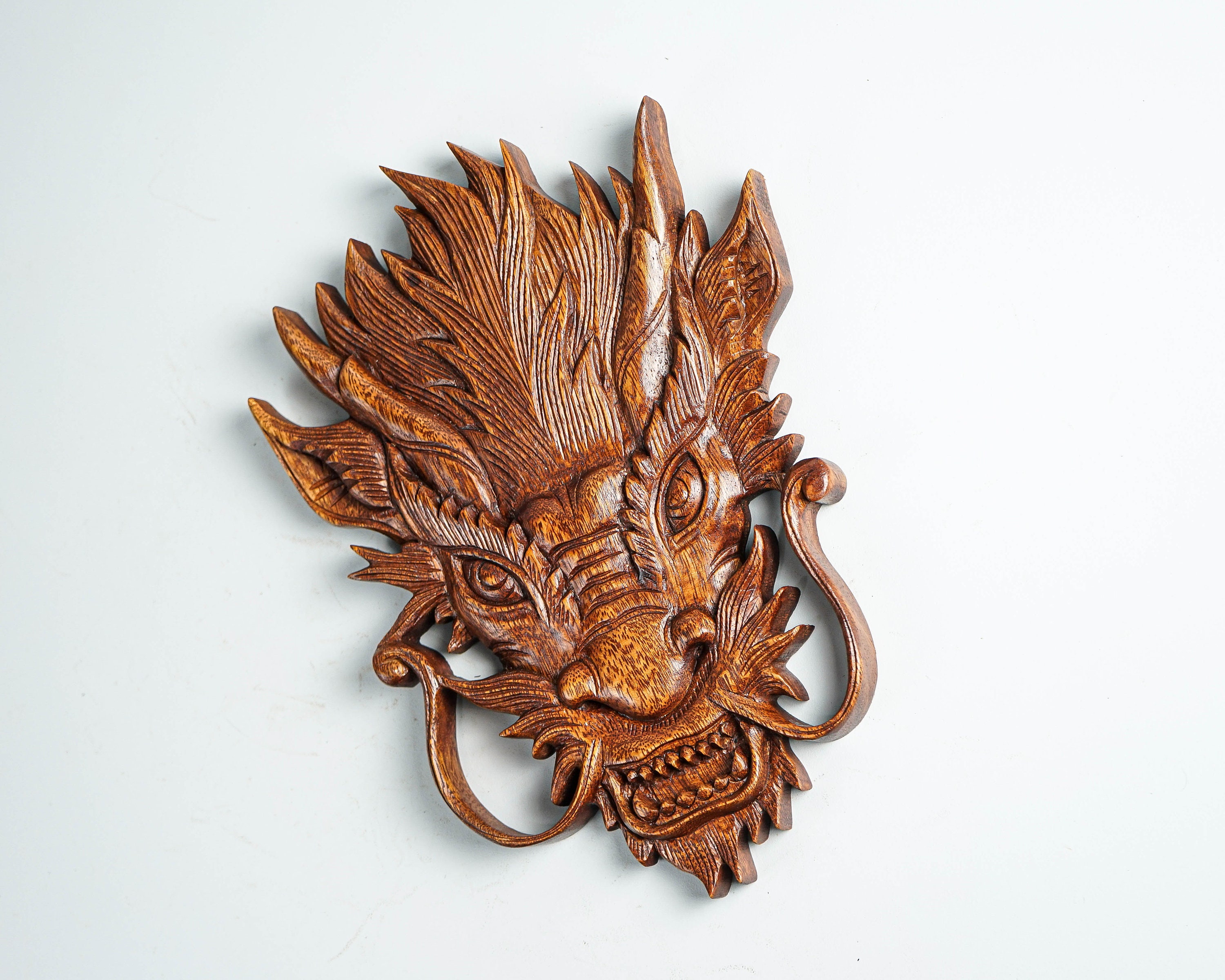A Chinese dragon head made of wood, dragon head with a