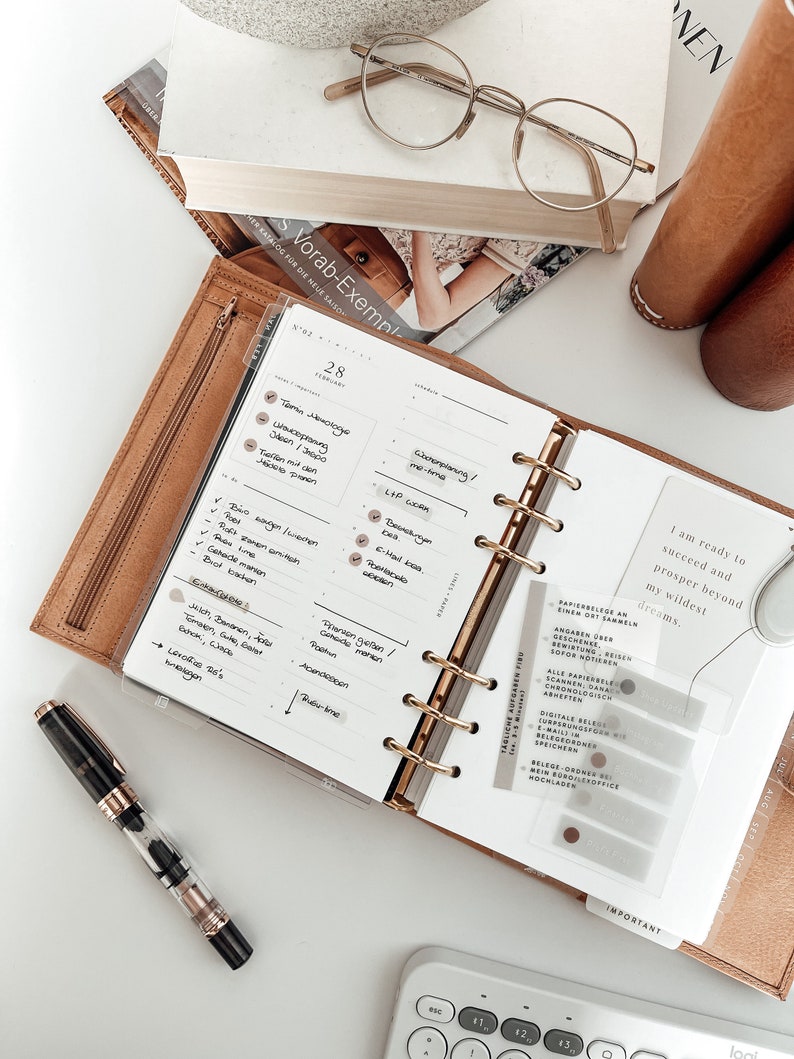 Printable Daily Inserts for Ring Planners, along with coordinating stickers and other accessories, create a well-organized and stylish planner setup.
