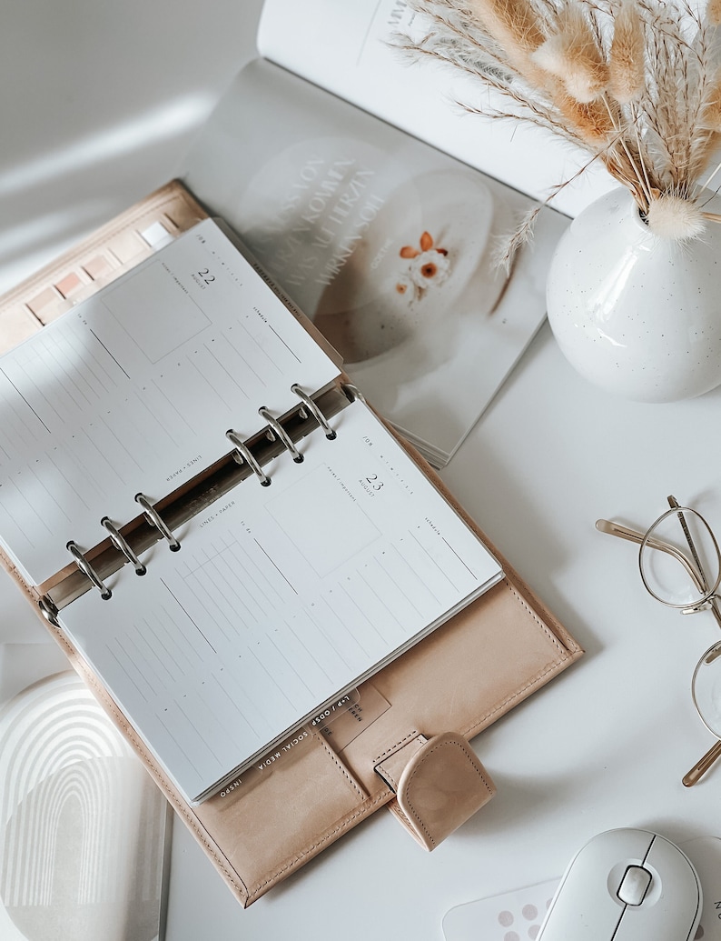 In this photo, the daily inserts are tucked into the planner without any labeling, ready for your customized planning.
