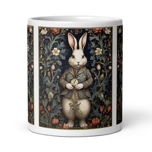 May include: White rabbit with a pocket watch, wearing a blue vest and standing in a lush green and blue floral pattern. The rabbit is surrounded by flowers and leaves.