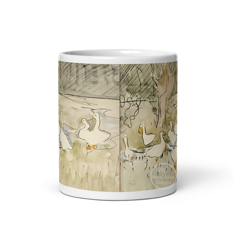 May include: White ceramic mug with a watercolor illustration of geese in a pond. The illustration is in shades of brown, gray, and blue. The mug has a white rim and handle.