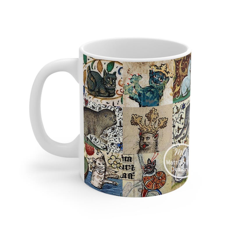 May include: White ceramic mug featuring a collage of medieval cat illustrations in various colors. The artwork includes cats with crowns, sitting, and in other poses. The mug has a white handle and interior.
