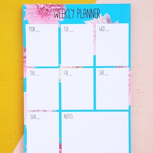 picture of a weekly planner, showing weeks with a line to allow customer to write the date. The calendar is around A6 has small boxes to add your plan. The calender has a blue background with floral patterns.
