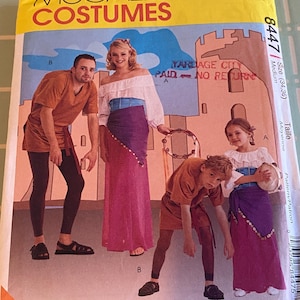 May include: A McCall's Costumes pattern envelope featuring illustrations of people in medieval-style costumes. The envelope has the text "McCall's Costumes" in large yellow letters. The costumes include tunics, leggings, and long skirts.