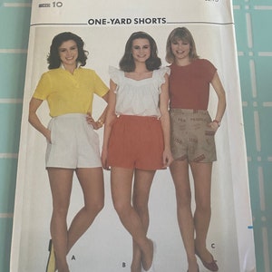 May include: A sewing pattern for one-yard shorts, featuring three women wearing different styles of shorts. The pattern is from Butterick and is size 10. The pattern is labeled "One-Yard Shorts" and the price is $2.75.
