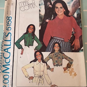 May include: Vintage McCall's sewing pattern for a set of blouses. The pattern is for misses' sizes 16 and bust size 38. The pattern features three different blouse styles, each with a different neckline and sleeve length. The pattern is from Mario's Corner.