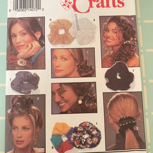 May include: Simplicity Crafts pattern 0524 for making hair scrunchies. The pattern includes instructions for making nine different styles of scrunchies, including a gold scrunchie, a white scrunchie, a black scrunchie, a plaid scrunchie, a colorful scrunchie, and a scrunchie with black beads.