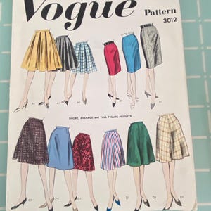 May include: A vintage Vogue sewing pattern envelope, number 3012, titled Basic Proportioned Skirts. The white paper cover features black text and colorful illustrations of various skirt styles, including pleated, pencil, and A-line designs in patterns and solid colors.