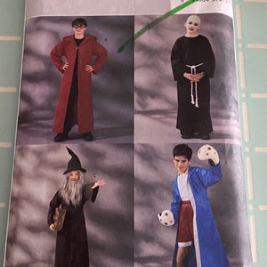 May include: A sewing pattern for four different costumes: a wizard, a boxer, a monk, and a hooded robe. The pattern is from Butterick and the number is 3989.