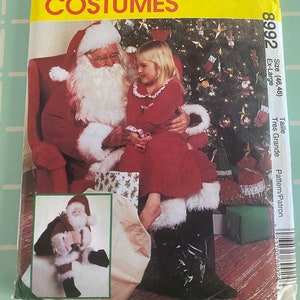 May include: McCall's Costumes pattern for an Ex-Large Santa Claus costume. The package features a photo of Santa Claus with a young girl, and a smaller image of a Santa Claus doll. The package is yellow and green.