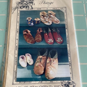 May include: A vintage sewing pattern for making a pair of fabric slippers. The pattern is titled "My Favorite Pair" and includes a quote: "These are a few of my favorite things".