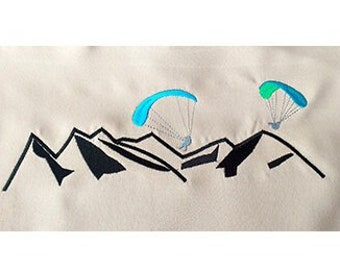 Lovers Paragliding over the Mountains