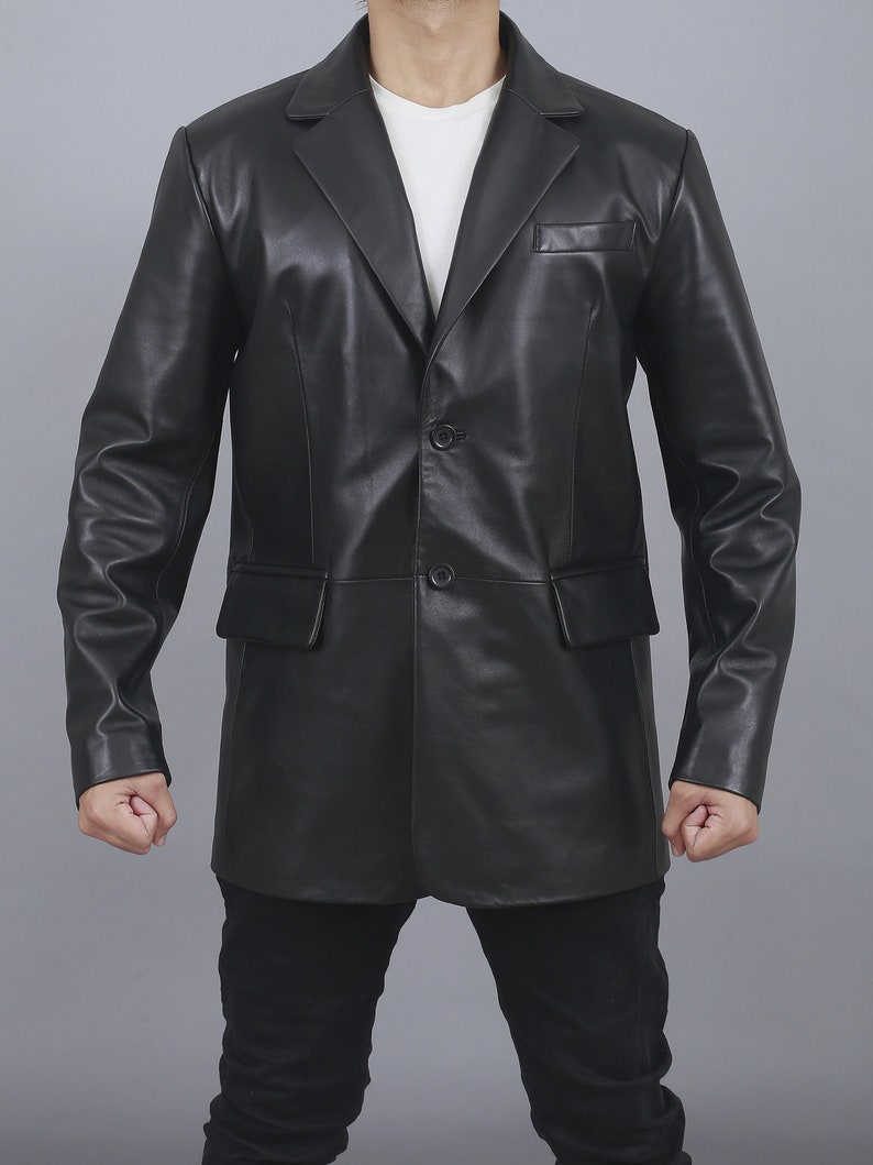 May include: A black leather blazer with a two-button fastening and a single pocket on the left chest.