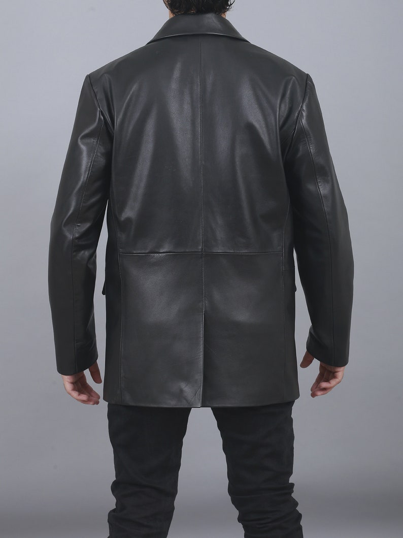May include: A black leather jacket with a double-breasted closure and long sleeves.