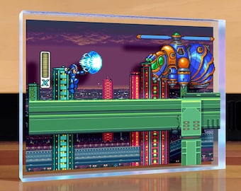 May include: A pixelated image of a video game scene featuring a blue robot character firing a blue energy blast at a flying, orange and blue robot. The scene is set against a backdrop of a city skyline at night.