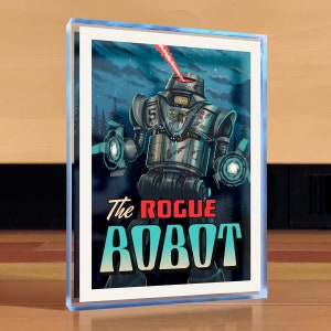 May include: A retro-style illustration of a silver robot with red eyes and a glowing red beam. The robot is standing in a dark forest with a starry sky in the background. The text "The Rogue Robot" is printed in red, blue, and white letters below the robot.