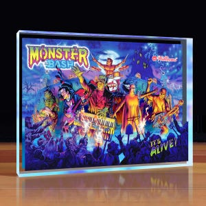 May include: A framed print featuring a vibrant illustration of a monster band performing on stage. The artwork includes the text "Monster Bash" and "It's Alive!" with various monster characters, a full moon, and a spooky castle in the background.