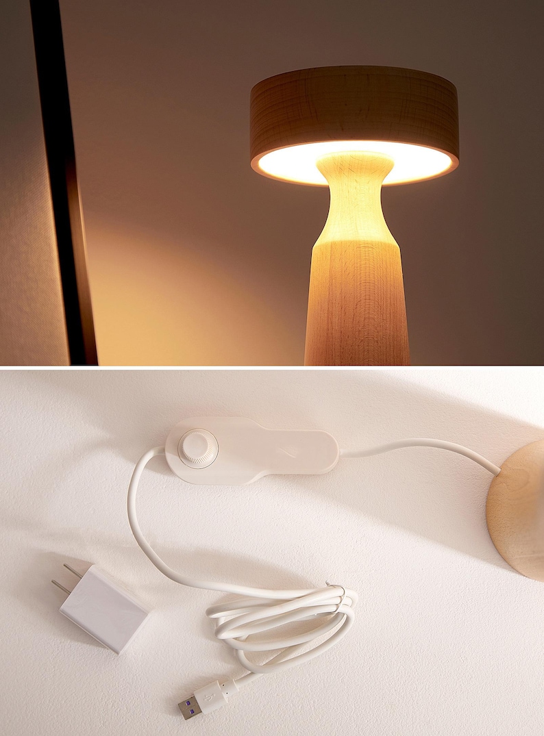 K&ouml;nnte beinhalten: Eine Tischlampe aus Holz mit einem pilzf&ouml;rmigen Schirm. Die Lampe hat ein wei&szlig;es Kabel mit einem Schalter und einem USB-Stecker. Die Lampe steht auf einer wei&szlig;en Oberfl&auml;che.