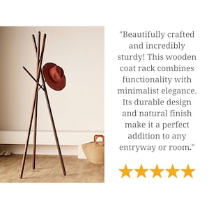 May include: A wooden coat rack with a triangular base and multiple arms for hanging coats and hats. The rack is made of natural wood and has a brown finish. A red hat is hanging on one of the arms.