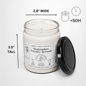 May include: A white candle with a black label that reads "September Twenty Second" and includes astrological symbols. The candle is 3.5 inches tall and 2.8 inches wide. The candle is in a glass jar with a black lid.