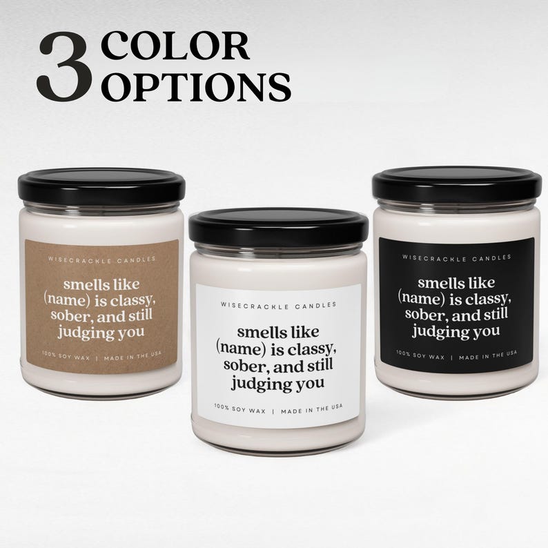May include: Three soy wax candles with black lids and labels that read "smells like (name) is classy, sober, and still judging you". The candles are in three different colors: white, light brown, and a light beige.