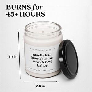 May include: A white candle with a black lid and a label that reads "WISECRACKLE CANDLES smells like (name) is the worlds best baker 100% SOY WAX | MADE IN THE USA". The candle is 3.5 inches tall and 2.8 inches wide.