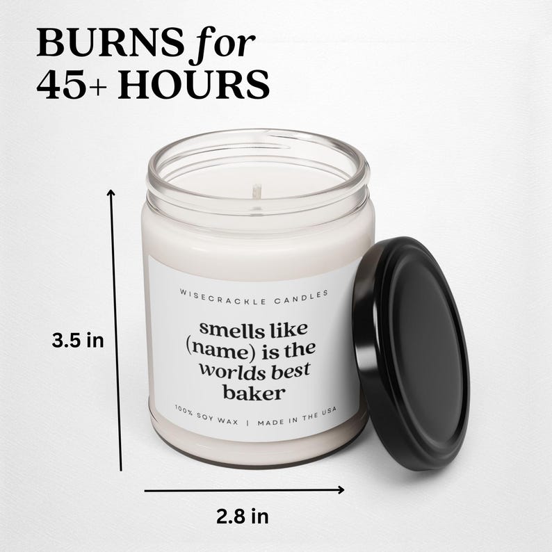 May include: A white candle with a black lid and a label that reads "WISECRACKLE CANDLES smells like (name) is the worlds best baker 100% SOY WAX | MADE IN THE USA". The candle is 3.5 inches tall and 2.8 inches wide.