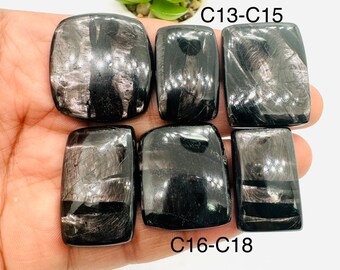 May include: Six black obsidian cabochons with silver streaks, arranged in two rows of three. The top row is labeled "C13-C15" and the bottom row is labeled "C16-C18".