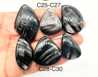 May include: Six black obsidian stones with silver streaks, arranged in a hand. The stones are labeled C25-C27 and C28-C30.
