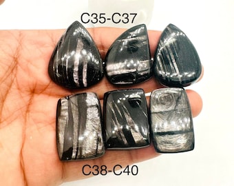 May include: Five black and silver obsidian cabochons, two teardrop shaped and three rectangular, with the text "C35-C37" and "C38-C40" printed below.