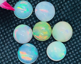 Ethiopische Opal 9MM Cabochon Code E # 37- Gewicht 2,5 cts AAAA Kwaliteit Ethiopische Opal Round Cabs , Pack van 1 PC Video beschikbaar.