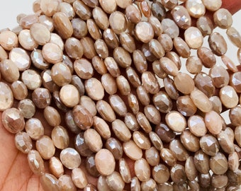 May include: A collection of faceted, oval-shaped beads in beige and brown hues. The beads, with a subtle shimmer, are strung together, creating a textured appearance. Suitable for crafting jewellery.