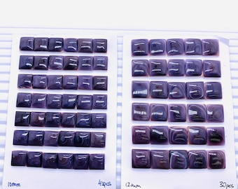 May include: Two sets of square, purple-hued gemstones, each arranged on a white card. One card is labeled "10mm" and contains 42 pieces. The other card, labeled "12mm", holds 30 pieces. The gemstones have a marbled appearance.