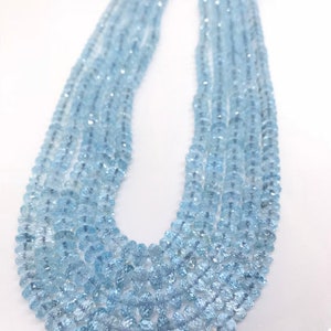 18 Inch Swiss Blue Topaz Faceted Roundel 5-10MM , Top Quality, Swiss Blue topaz faceted Beads. Listing of single strand