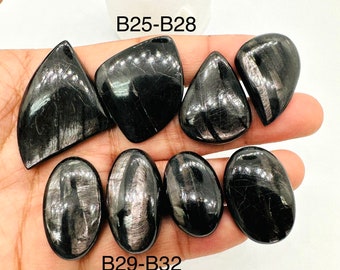 May include: Six black obsidian stones with silver streaks, labeled B25-B28 and B29-B32.