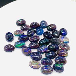 Black Opal Cabochon • 6x8 mm Size • Pack of 4 Pcs • Code B10 - AAA Quality • Natural Opal Dark Blue Treated Color • Ethiopian Opal  Cabochon