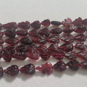 GARNET 7x9 Garnet Full Carving Pear Shape , Length 16 " , GARNET fancy shape . leaf carving .