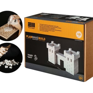 May include: A cardboard box with a white castle model on the front. The box is labeled "PlanMakeBuild" and "Tower 'Gate'". The box is also labeled with a CE mark and a 6+ age recommendation.