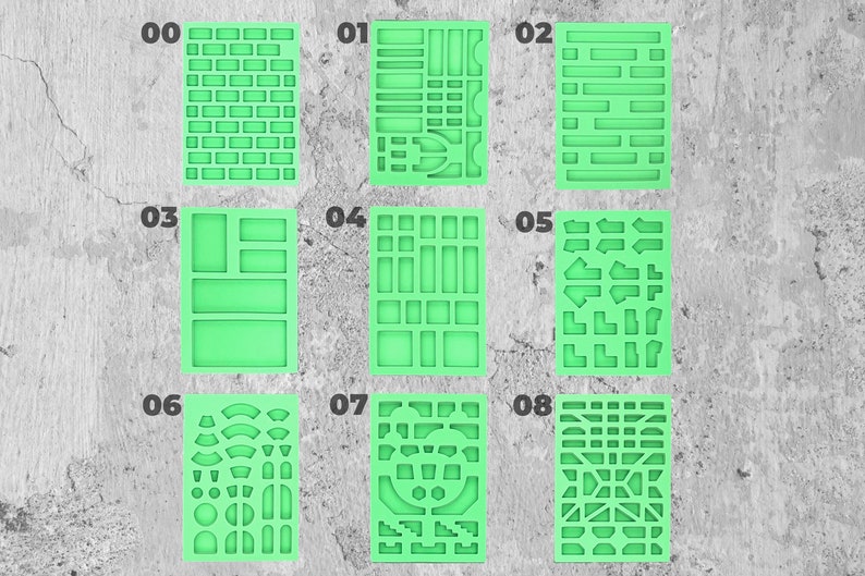 May include: Eight green silicone stencils with different patterns, numbered 00 to 08. The stencils are for crafting and creating patterns on various surfaces.