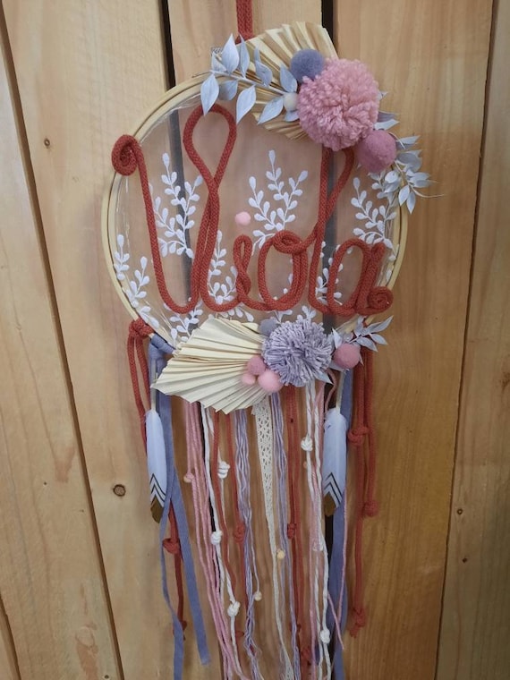 Dream catcher with names and dried flowers